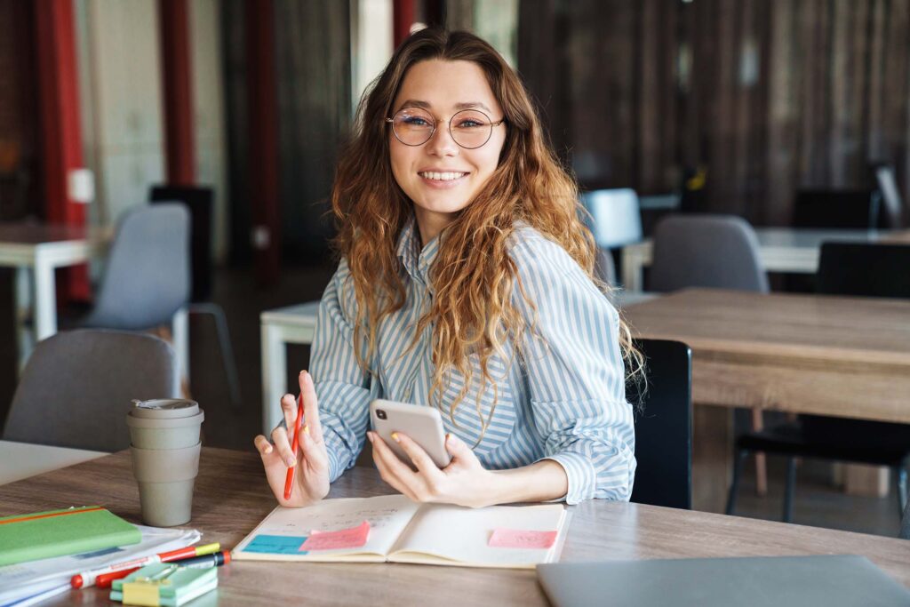 image-of-joyful-charming-woman-using-cellphone-whi-QYKSX3S.jpg